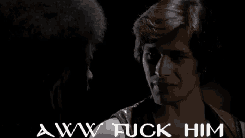 a man and a woman are looking at each other with the words " aww fuck him " on the bottom