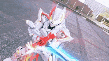 a robot with a red and blue sword