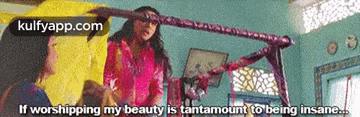a woman is talking to another woman in a room with the words if worshipping my beauty is tantamount to being insane ..