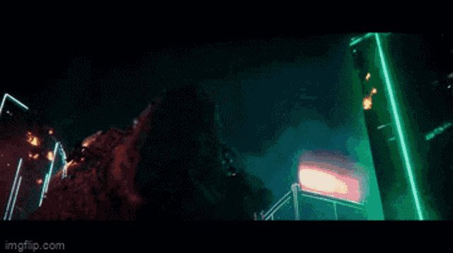 a whale is flying through the air in a city at night