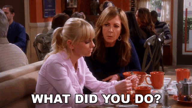 two women sit at a table in a restaurant with the words what did you do below them