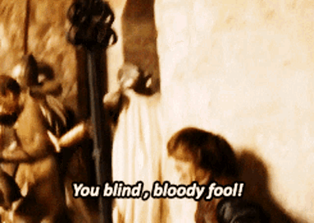 a man says " you blind bloody fool " in front of a group of people
