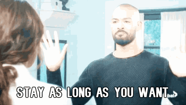 a man waving at a woman with the words stay as long as you want written below him