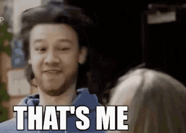a man is smiling and saying `` that 's me '' while talking to a woman .