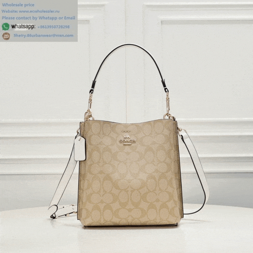 a coach purse is sitting on a table