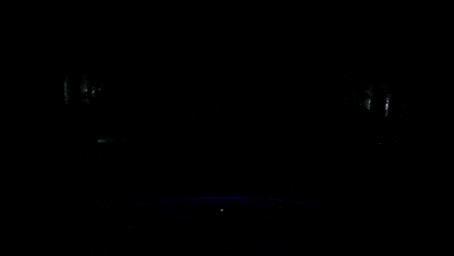 a man in a space helmet is standing in front of a screen with a purple background