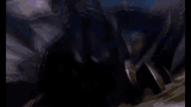 a black and purple monster with purple horns and a purple tail