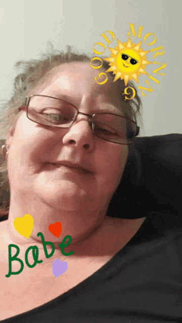 a woman wearing glasses has the word babe written on her neck