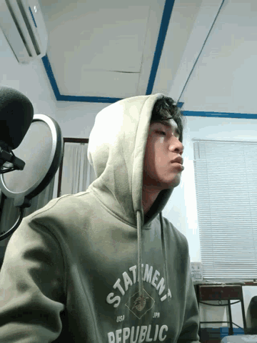 a man wearing a hoodie that says republic