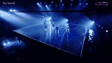 a group of people dancing on a stage with the words free yourself written on the bottom