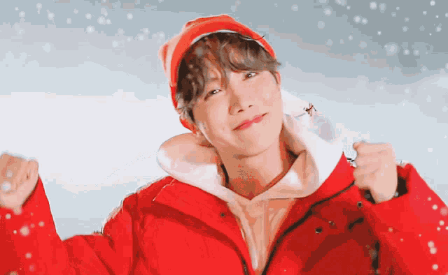 a man wearing a red jacket and a red hat
