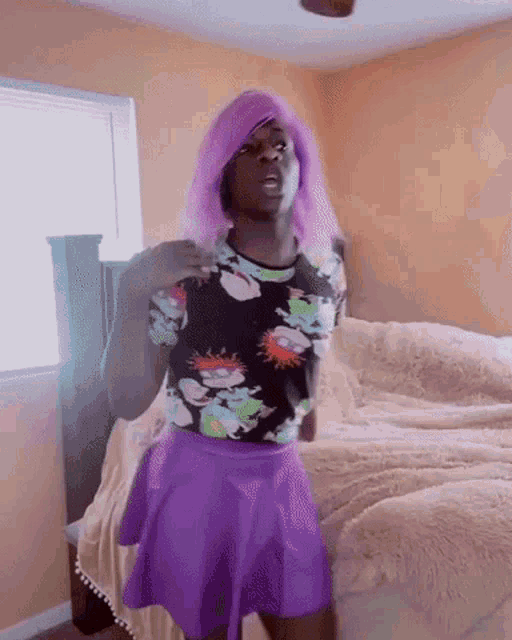 a person with purple hair and a rugrats shirt