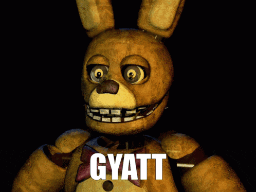 a yellow stuffed animal with the word gyatt on it