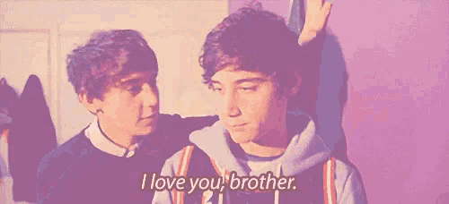 two young men are standing next to each other and one of them is saying `` i love you brother '' .