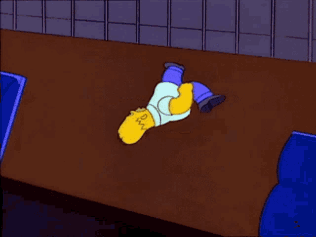 a cartoon of homer simpson laying on his back on the floor