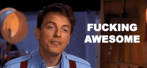 a man in a blue shirt and red suspenders has the words fucking awesome written on his face
