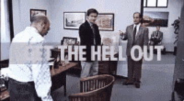 a group of men standing in an office with the words " get the hell out "