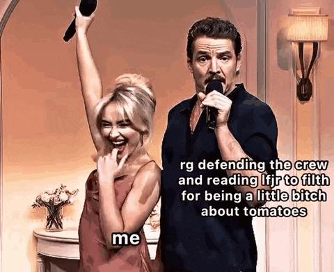 a man and a woman are standing next to each other with a microphone in their hands .