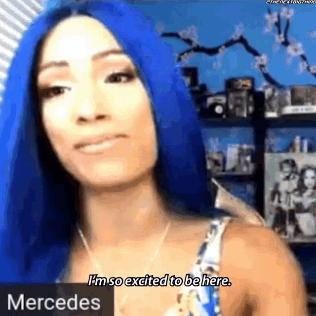 a woman with blue hair says i 'm so excited to be here mercedes