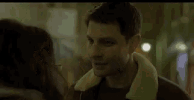 a man and a woman are looking at each other and the man is telling the woman that she is beautiful .