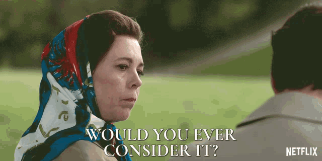 a woman with a scarf around her head says " would you ever consider it " in front of a man