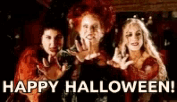 three women in witch costumes are standing next to each other with the words happy halloween written below them .