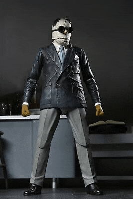 a man in a suit and mask is standing in front of a counter .