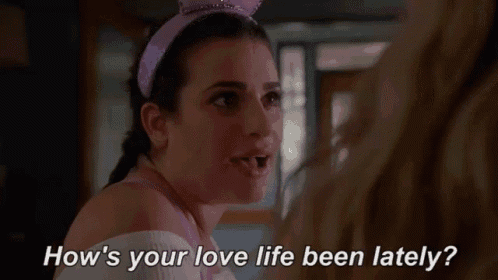 a woman wearing bunny ears is talking to another woman and asking how 's your love life been lately .