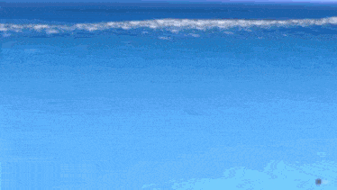 a person is diving into the ocean with their feet in the water .