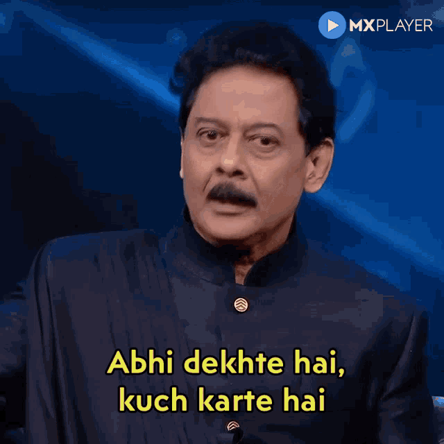 a man says abhi dekhte hai kuch karte hai on a screen