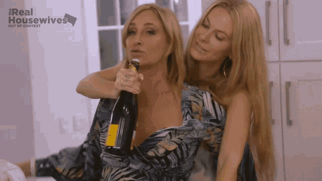 two women drinking from a bottle with the words real housewives out of context on the bottom