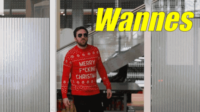 a man wearing a merry f * cking christmas sweater