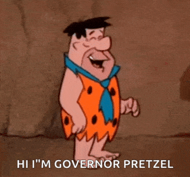 flintstone from the flintstones is standing in front of a rock wall and says `` hi i 'm governor pretzel ''