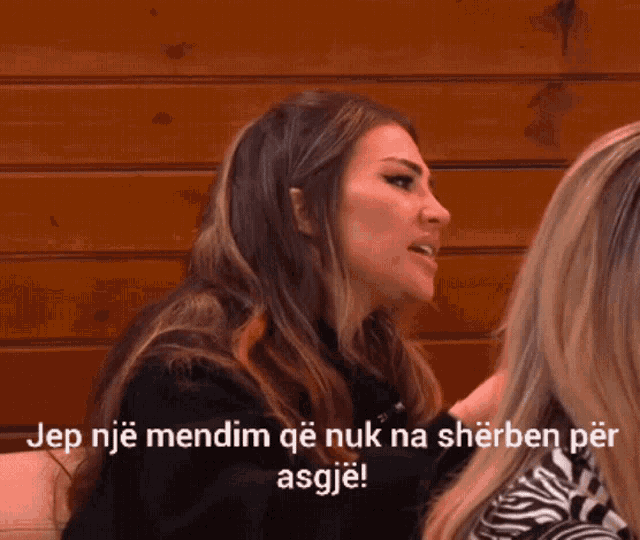 a woman is talking to another woman with the words dep nje mendim qe nuk na sherben per asgje at the bottom