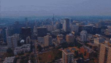an aerial view of a city with a few buildings including one that says ' alberta ' on it