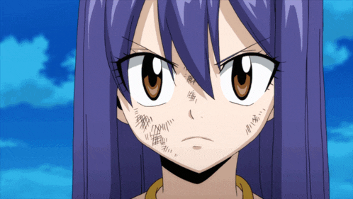 a girl with purple hair and brown eyes looks angry