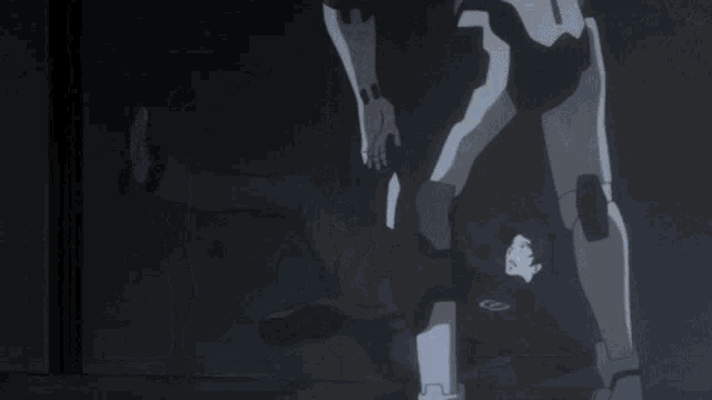 a person 's foot is visible in a dark room with a black background .