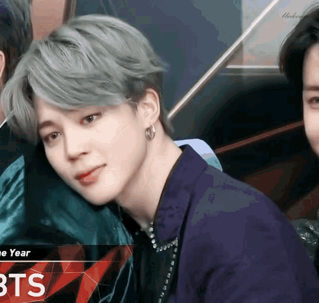 a close up of a man 's face with the word bts in the corner