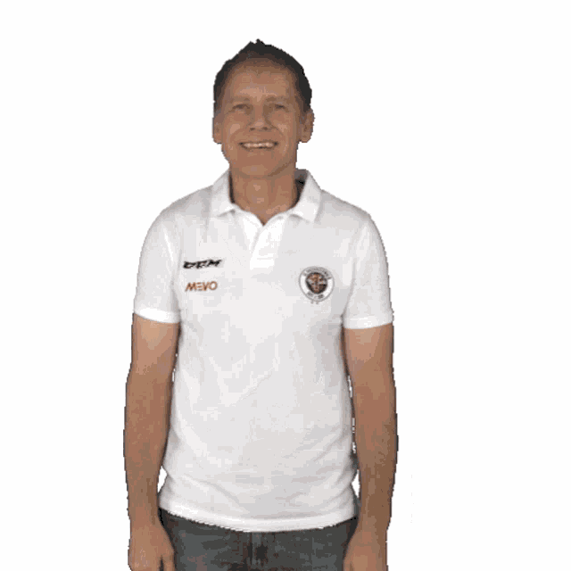 a man wearing a white mayo shirt is flexing his arms