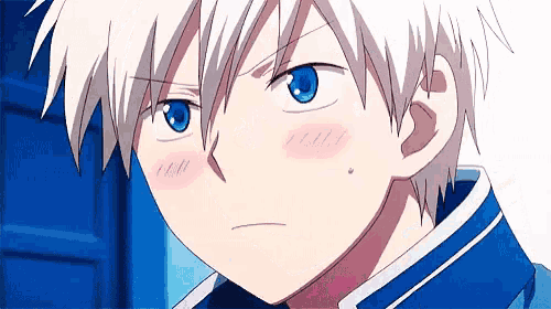 a boy with white hair and blue eyes is making a funny face .