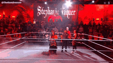 stephanie vaquer is standing in the middle of the ring
