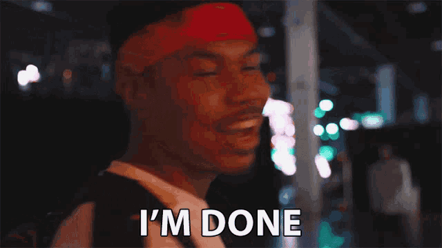 a man with a bandana on his head says " i 'm done "