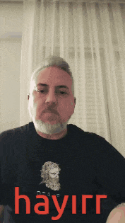 a man with a beard is wearing a shirt that says hayirg