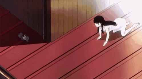 a girl in a white dress is crawling on a red floor .