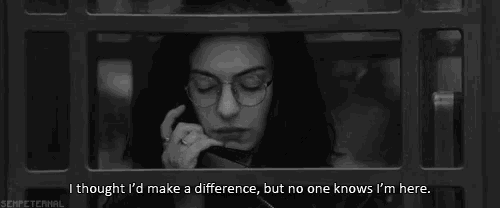 a black and white photo of a woman talking on a cell phone with a quote below her
