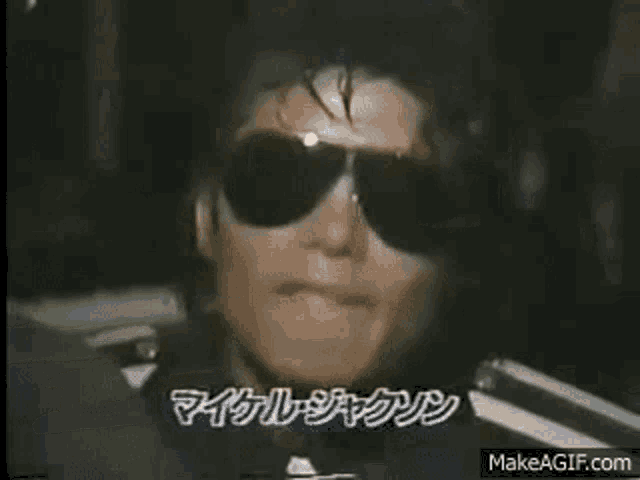 a close up of a person wearing sunglasses .
