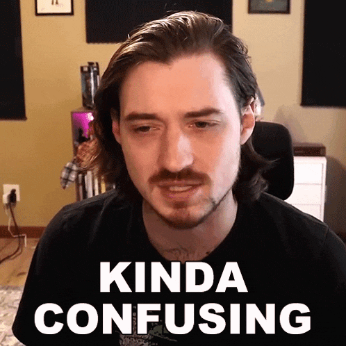 a man with long hair and a beard is making a kinda confusing face