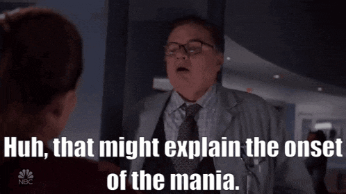 a man in a lab coat and tie is talking to a woman and the words huh that might explain the onset of the mania