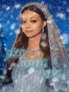 a woman in a wedding dress with a veil on her head says good morning guys