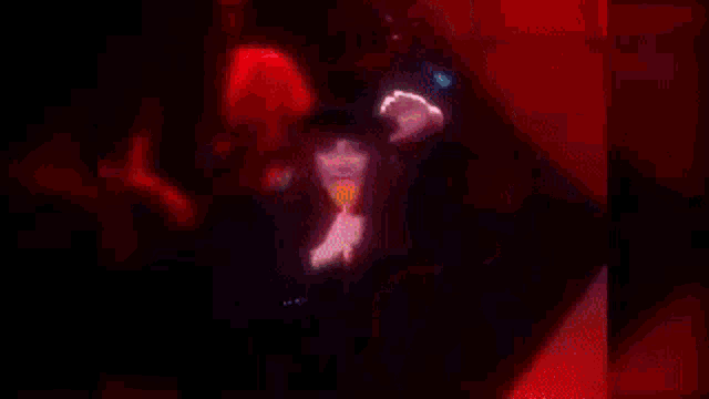 a woman with long hair is singing into a microphone .